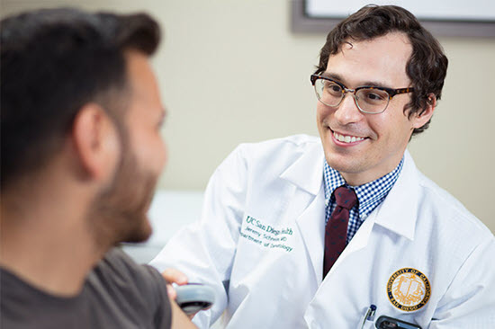 dr. schneider giving a dermatology consult to a patient